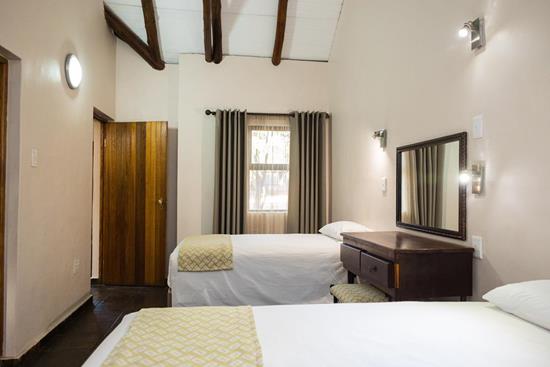 Phalaborwa Safari Park, A Forever Resort: 4-Sleeper Chalet. 2 bedrooms (1 queen bed, 2 single beds)